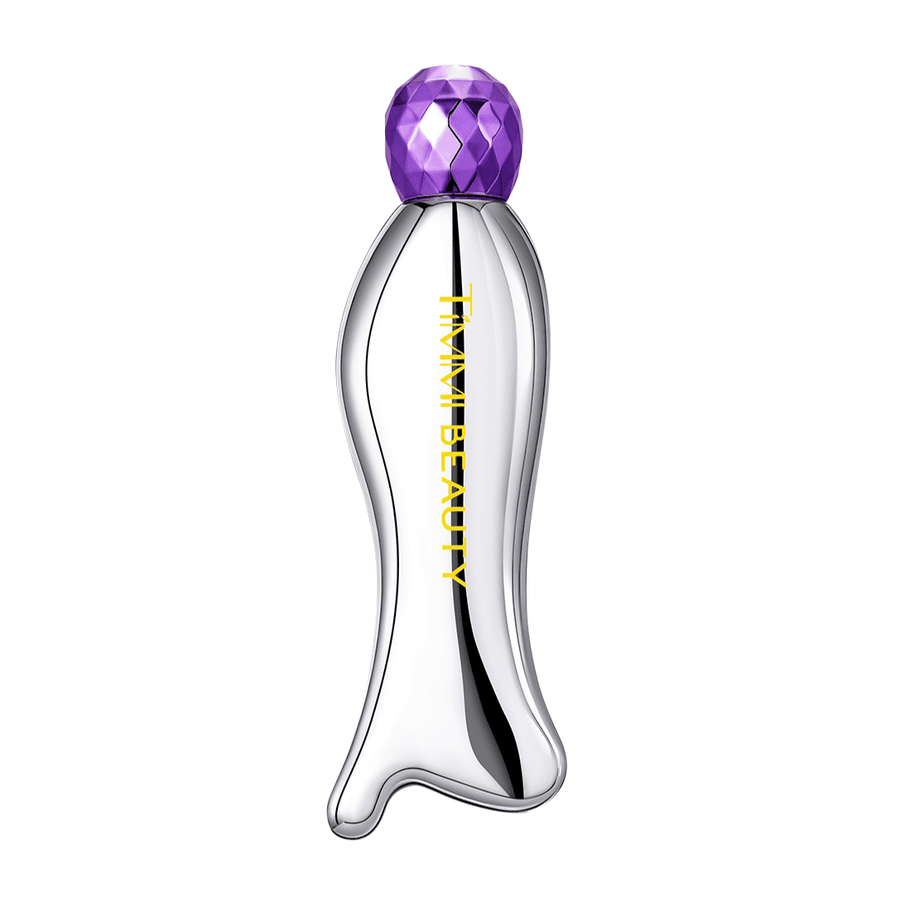 TIMMI Beauty Gua Sha Eye Serum in a sculpted silver bottle with purple cap